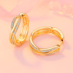 Ohrringe aus Edelstahl, vergoldet, gedrehte Zirkonia Creolen