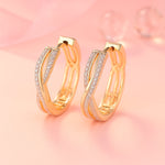 Ohrringe aus Edelstahl, vergoldet, gedrehte Zirkonia Creolen